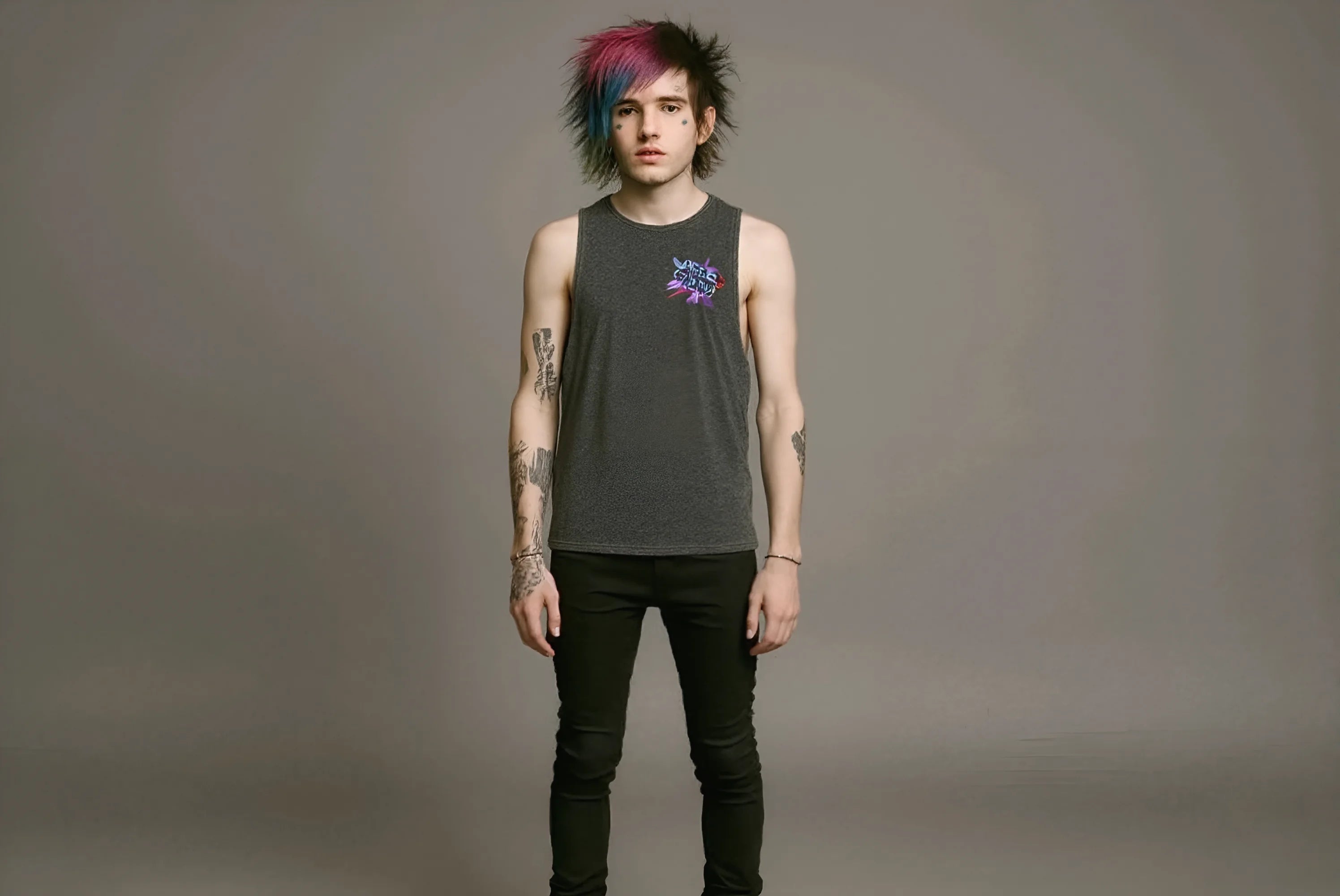 Person wearing a sleeveless shirt with a logo on a gray background