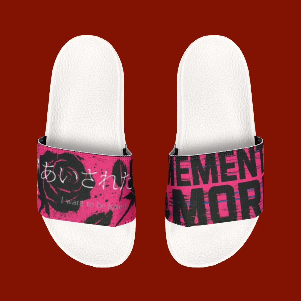 White slippers with pink and black straps on a red background