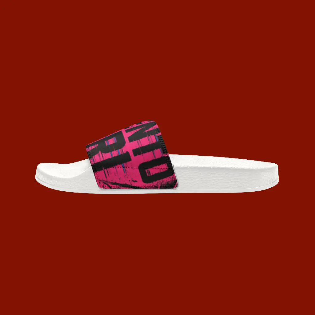 White slide sandal with a pink and black strap on a red background