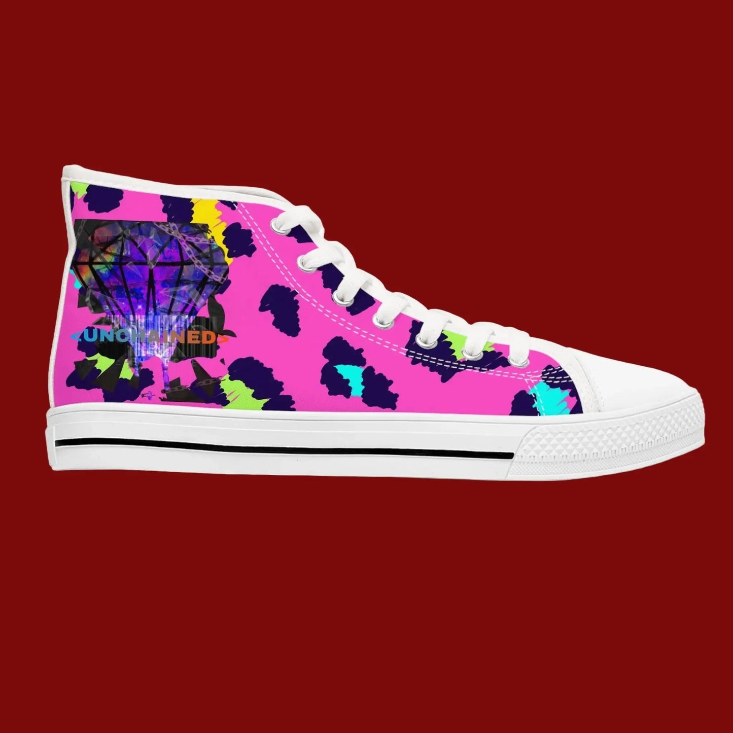 Pink high-top sneaker with colorful abstract design on a red background